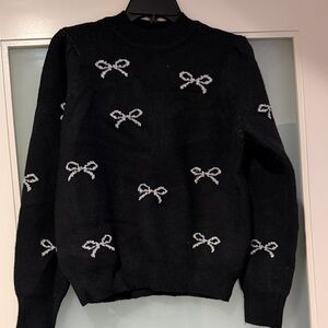 Nanette lapBlack Sweater with White Bow Accents